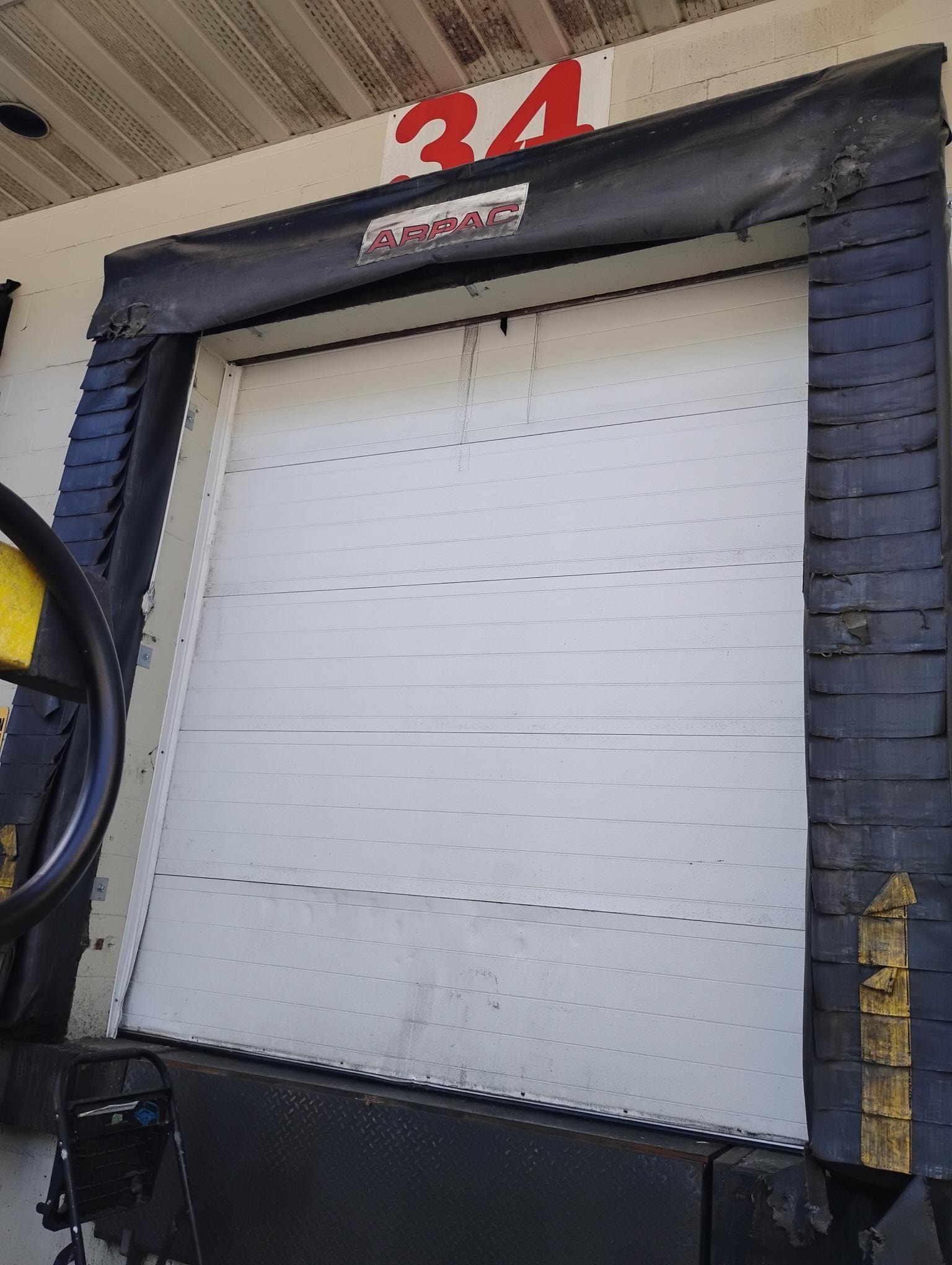 Dock seal and overhead door with dock bumpers
