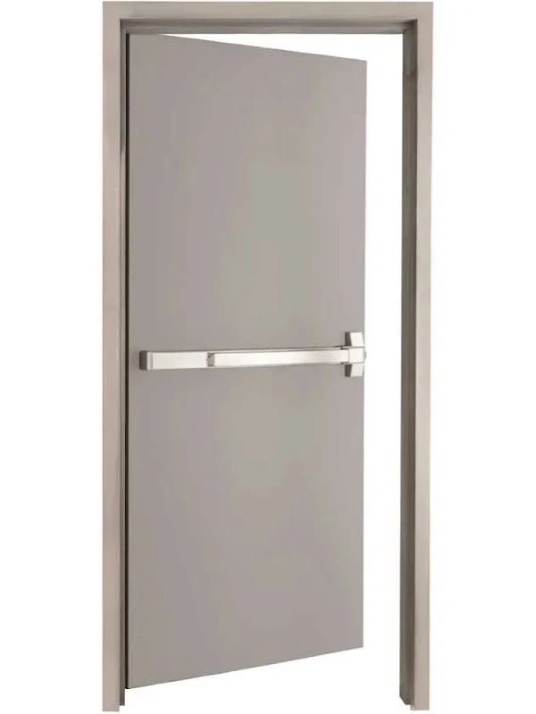 Grey steel man door with closer and lever hardware in commercial facility